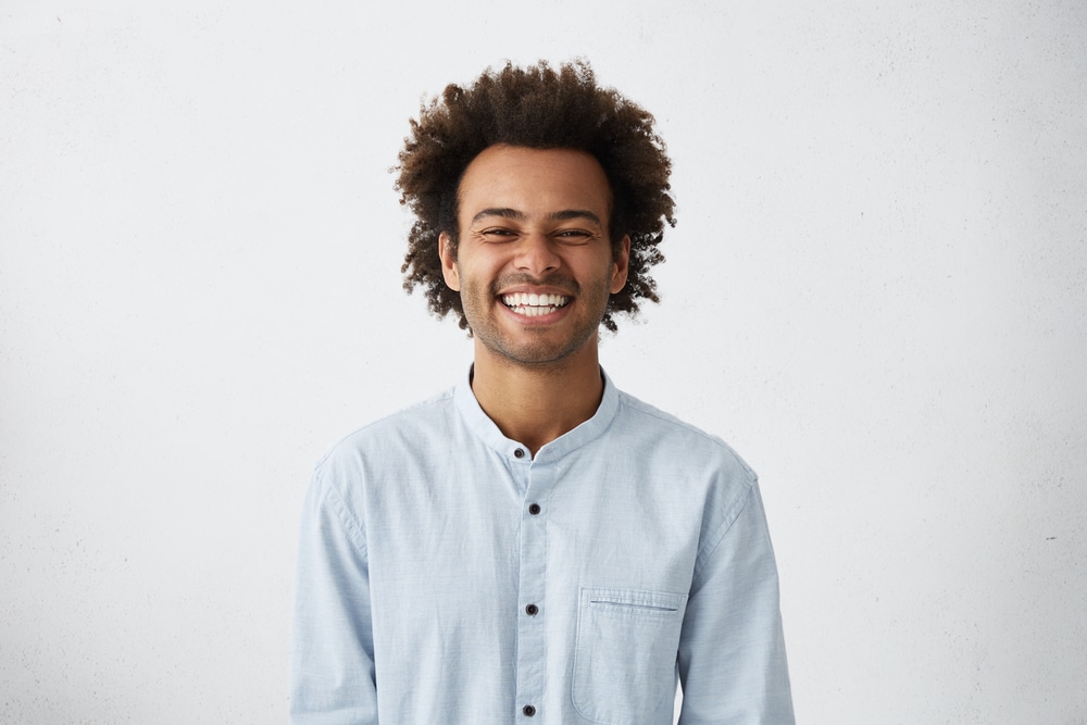 Handsome,Unshaven,Young,Dark-skinned,Male,Laughing,Out,Loud,At,Funny